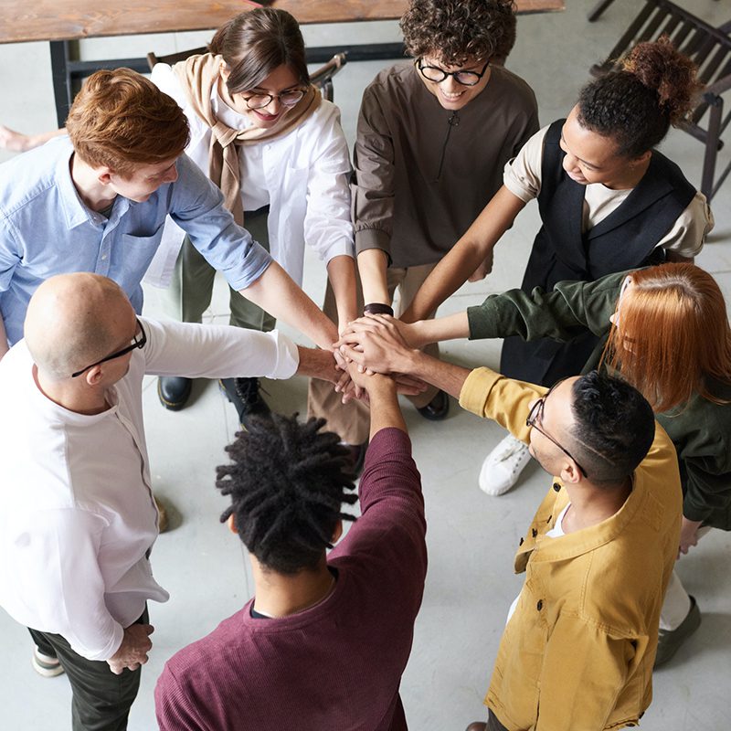 Group of people together with hands