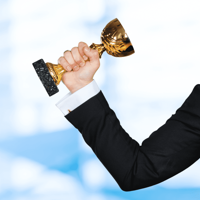 businessman-holding-golden-cup-trophy